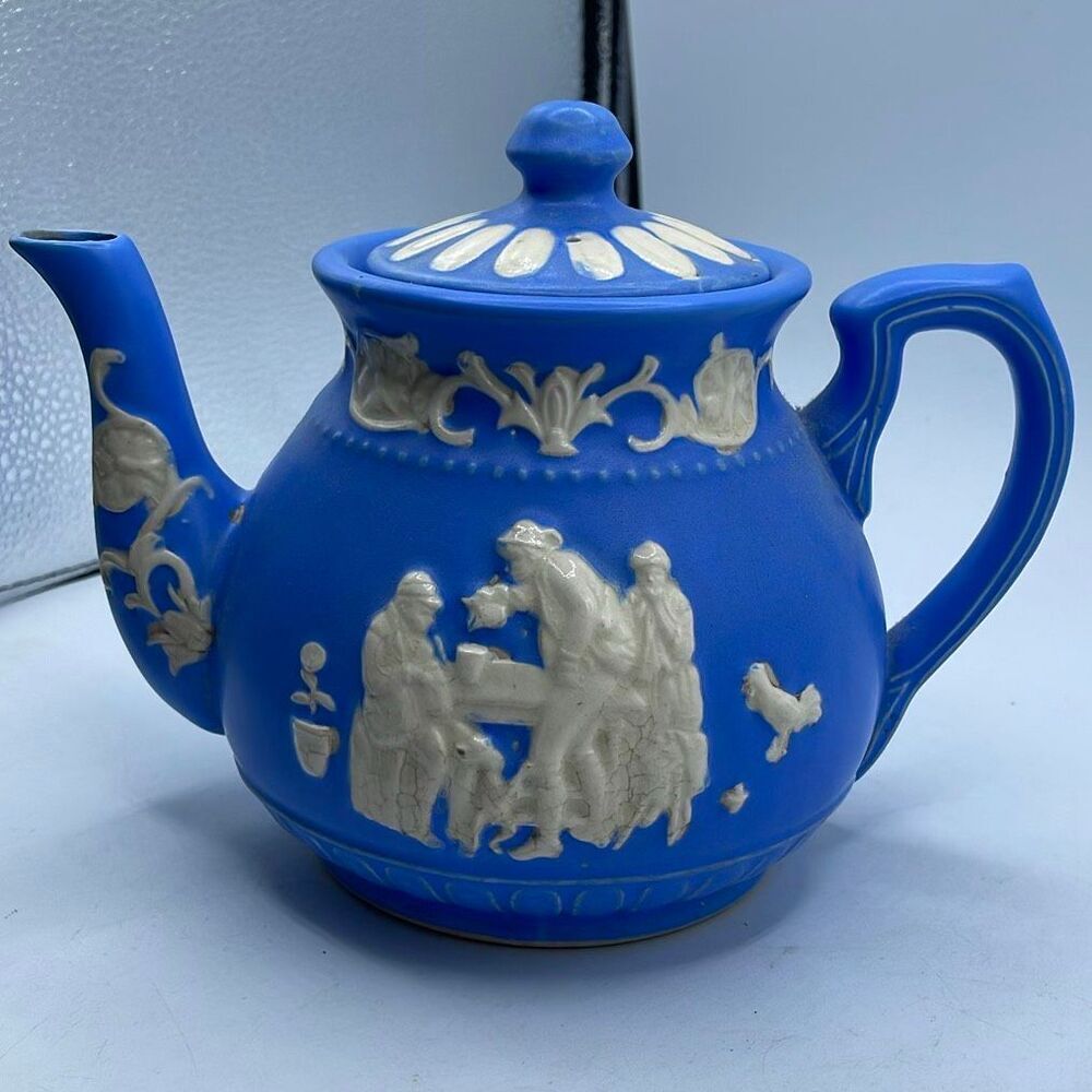 Vintage Jasperware blue teapot blue body white relief figures.
